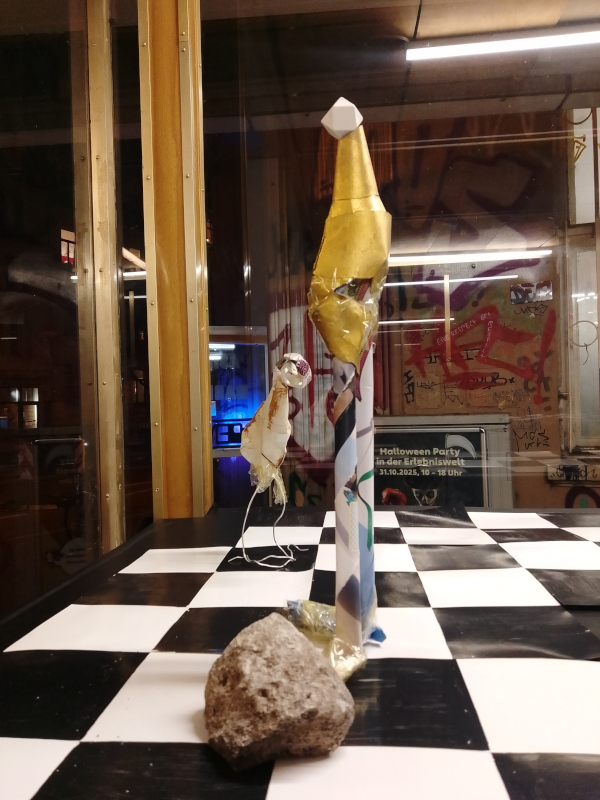 The golden figure wobbles slightly. Did you see that? No one answers.